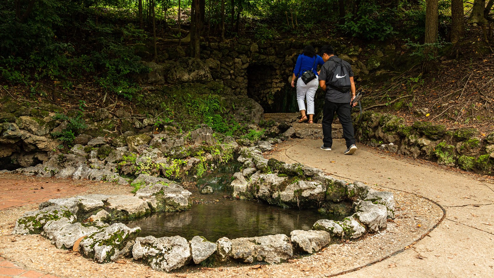 A couple admiring the thermal water from the display spring