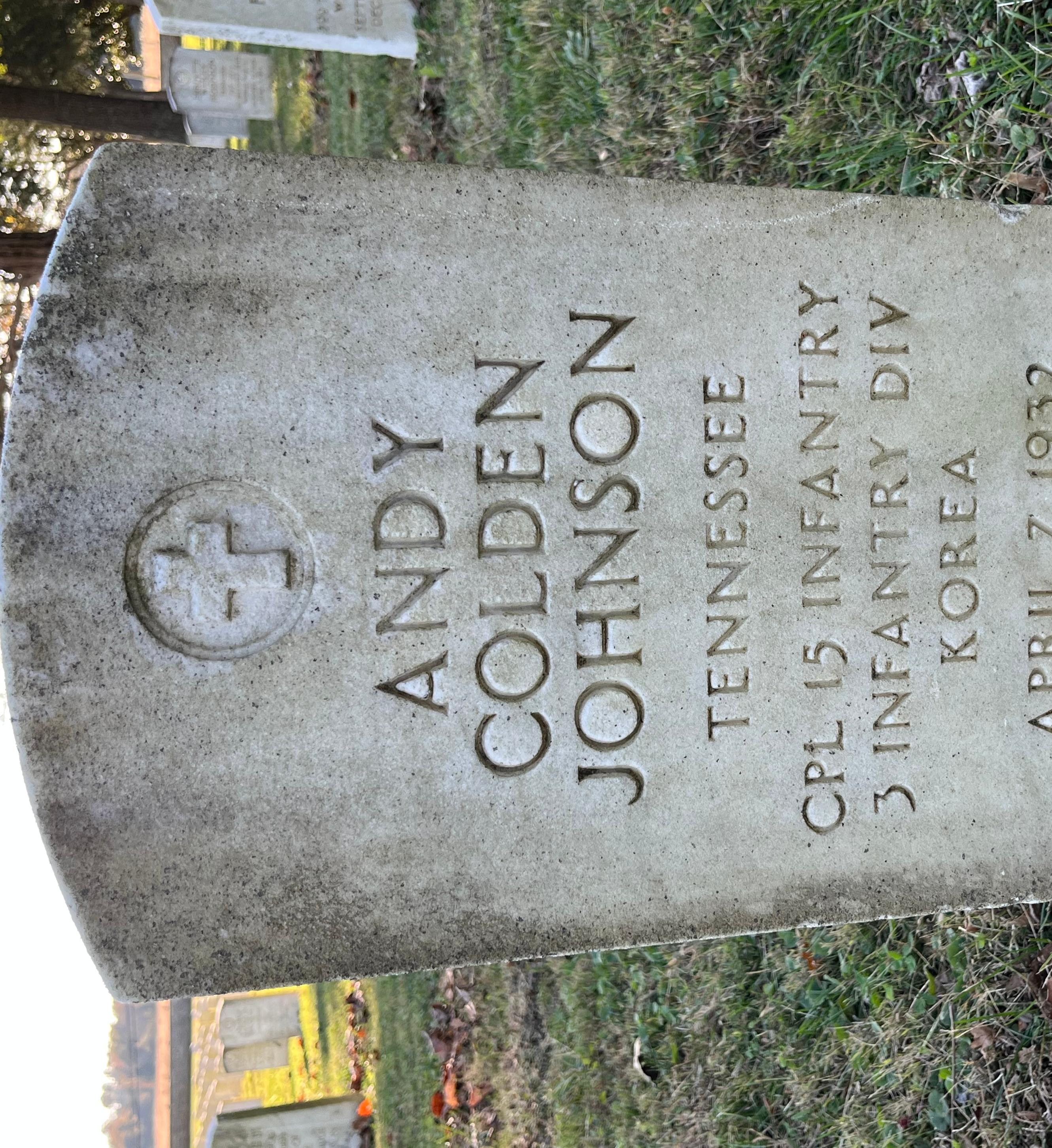 White marble headstone of Andy Colden Johnson