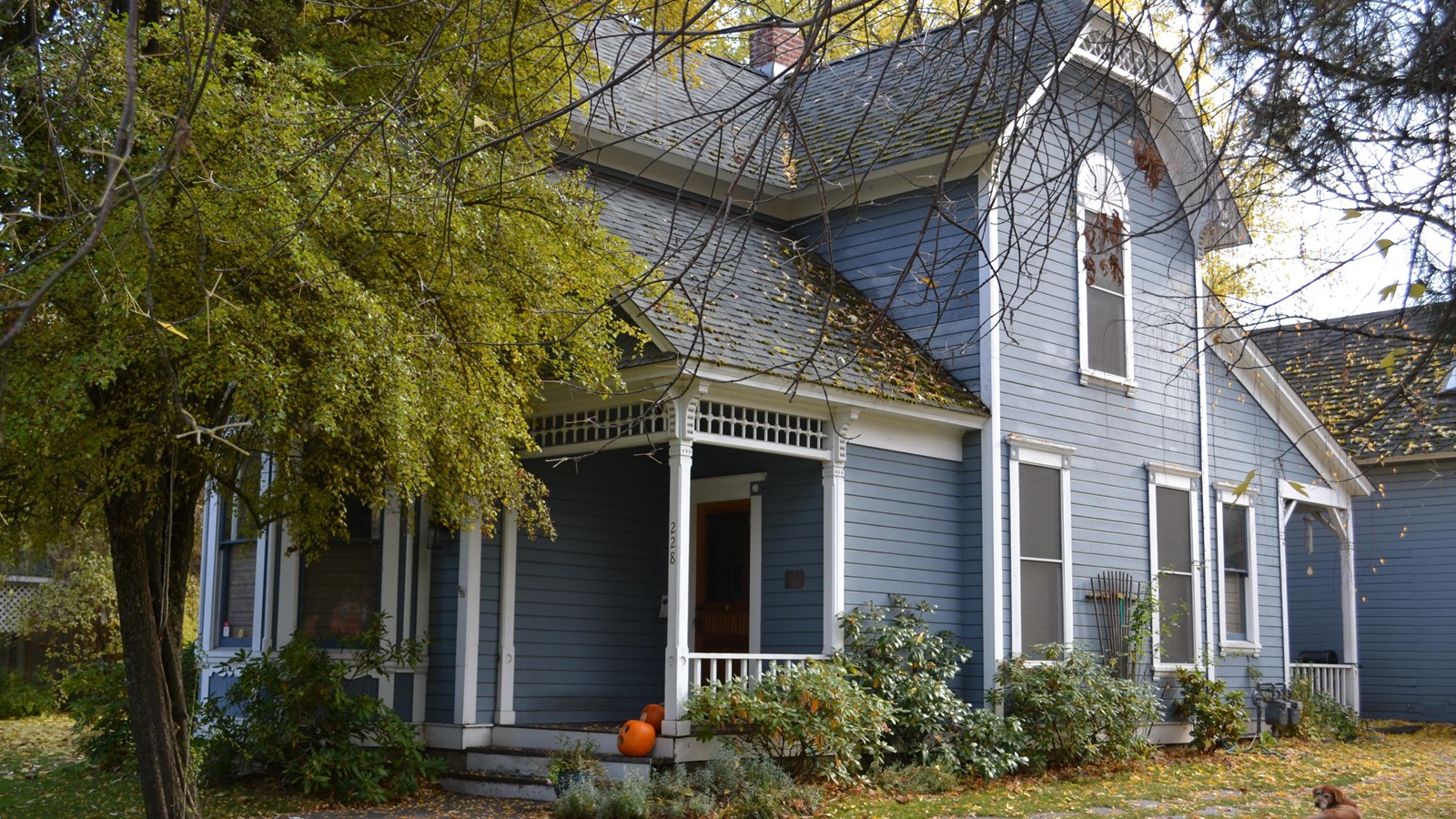 Two-story blue house. 