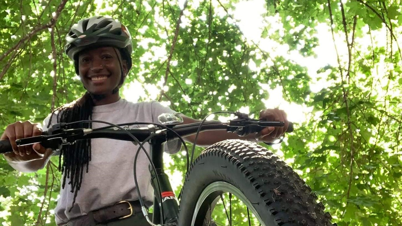 A ranger on a bicycle