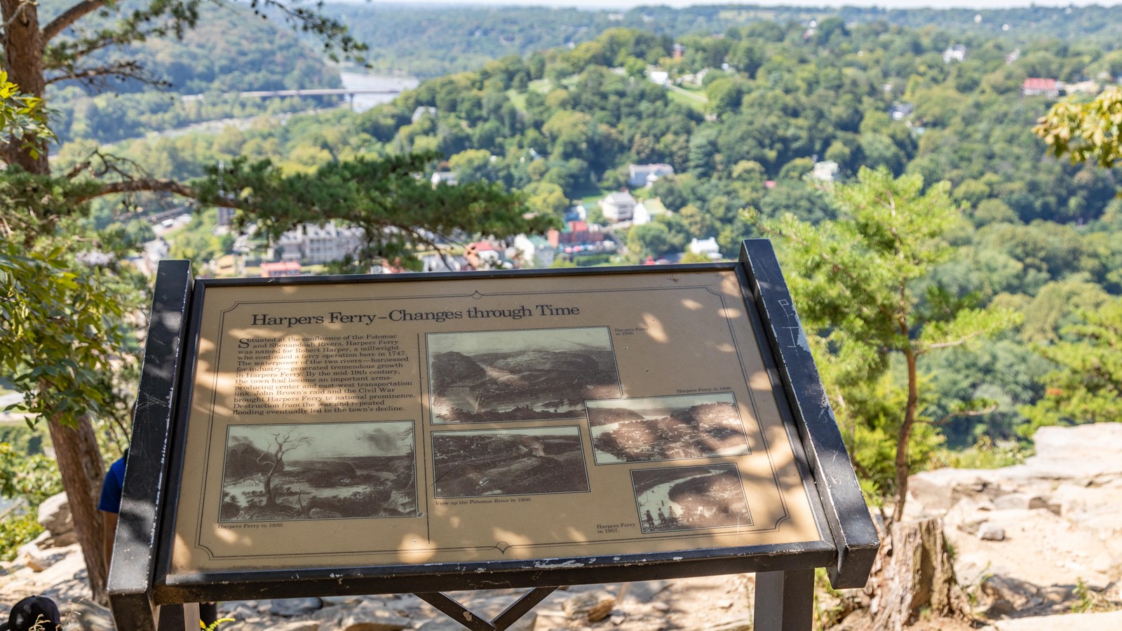 Series of photographs showing changes to the town from 1837 to 1959. The town is in the background.
