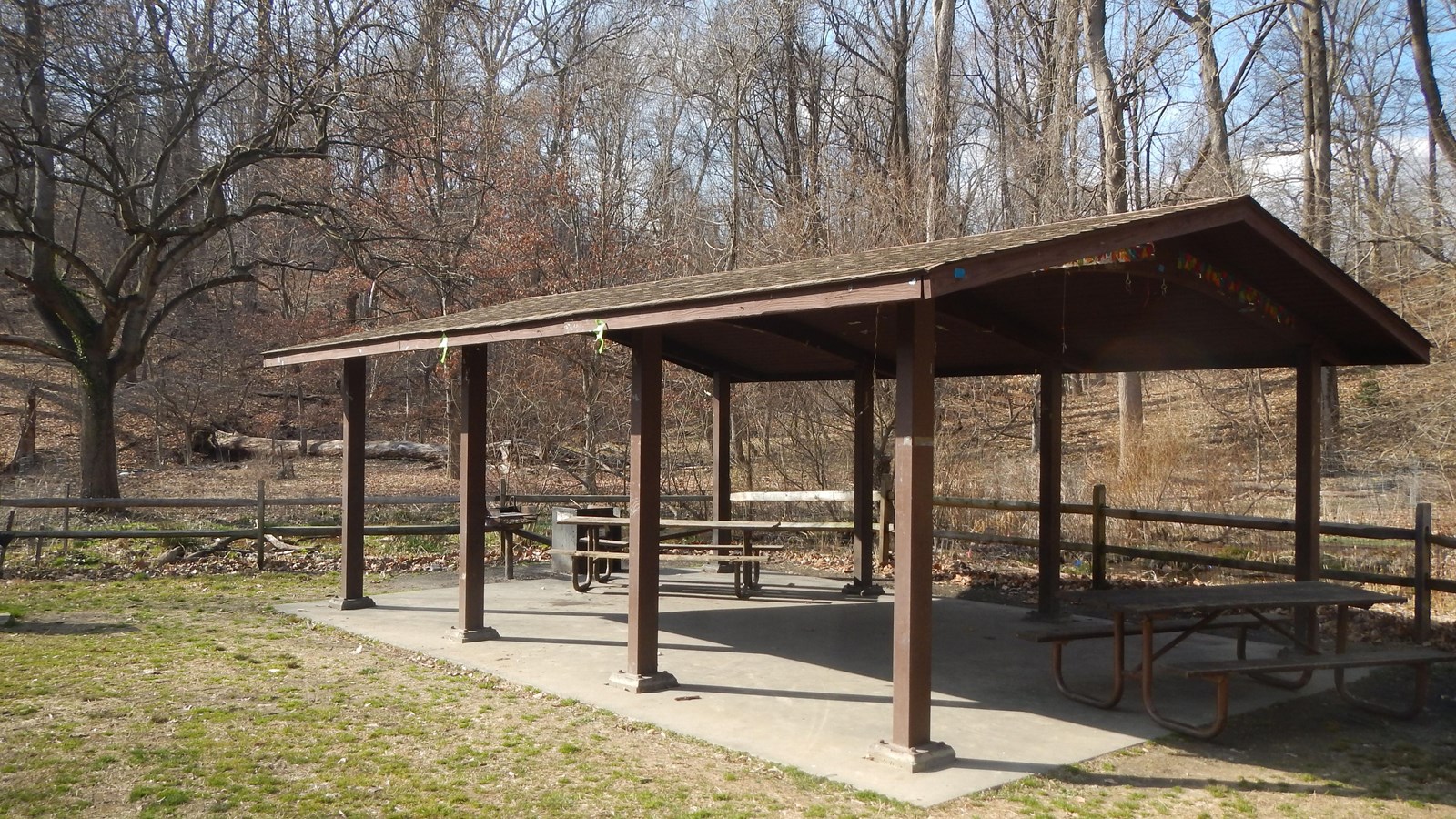 A picnic pavilion surrounded by grass