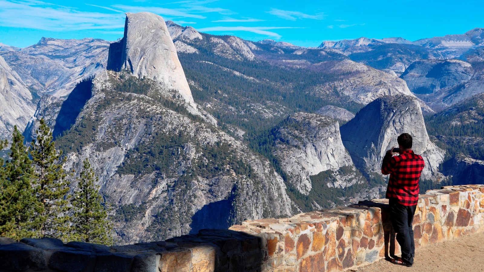 Visitor enjoying the view with Half Dome in the background