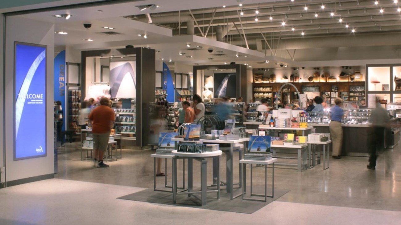 looking into the store, a large area with tables and racks of merchandise