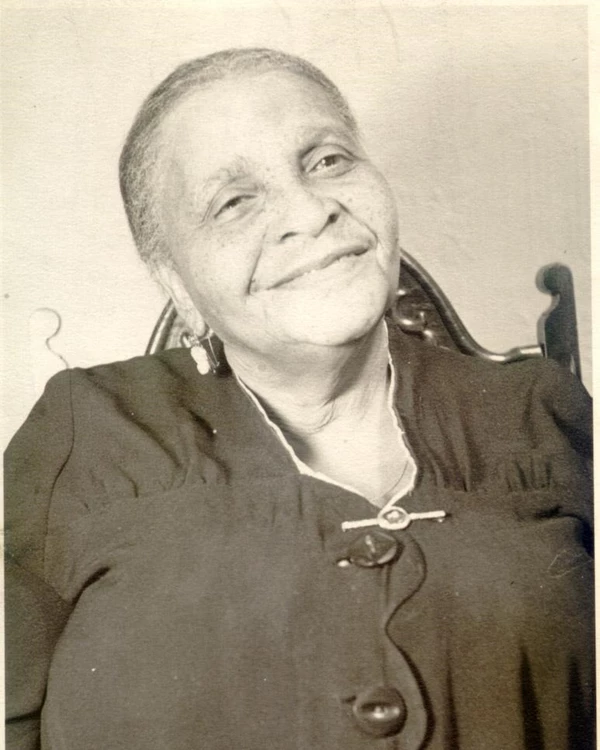 older Margaret "Polly" Payne sitting in a chair