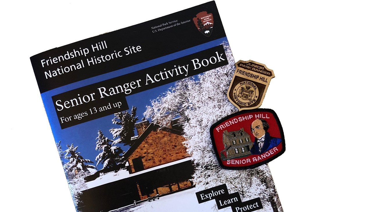 The Friendship Hill Senior Ranger Activity Book, patch, and Junior Ranger Badge