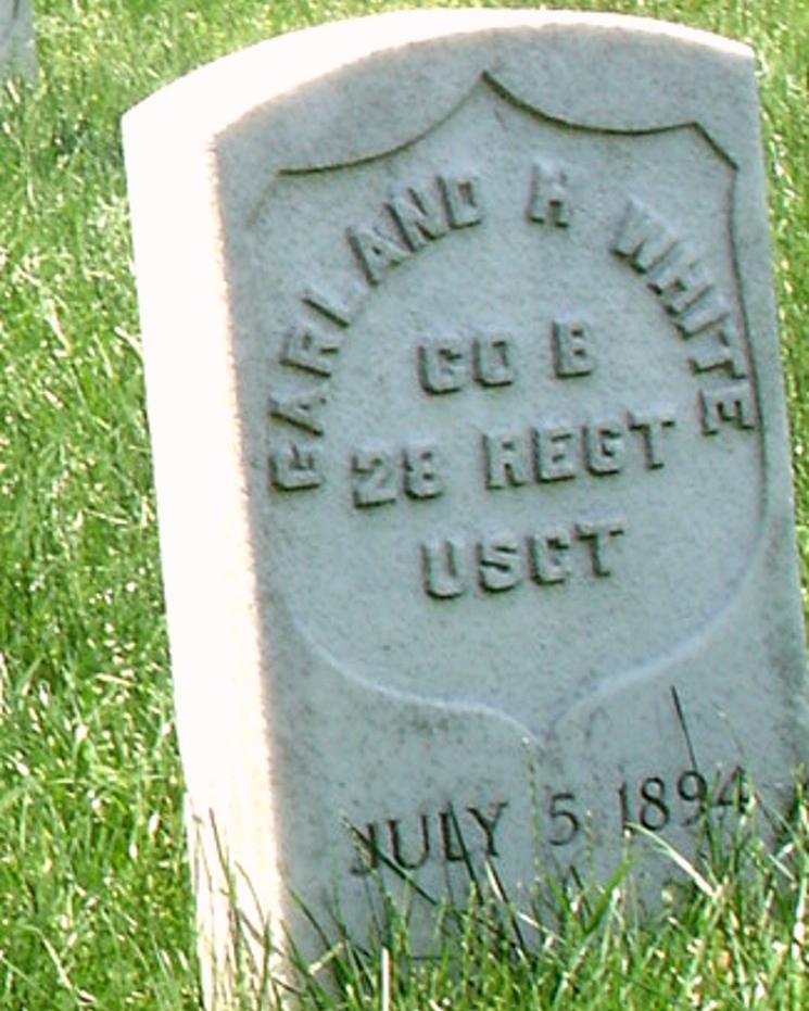 White marble headstone with text reading Garland H. White Co B 28 REGT USCT July 5 1894.