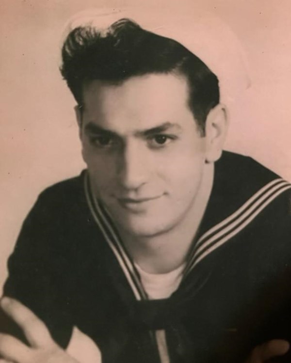 Portrait photograph of a young man in dress navy blues