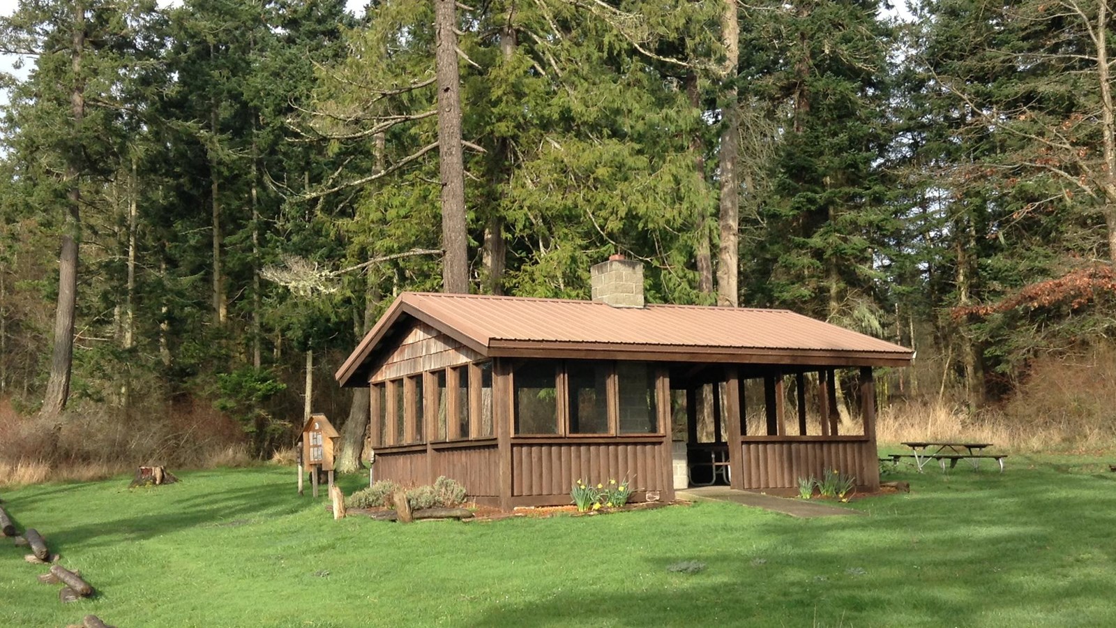 Color photograph of a wooden picnic shelther