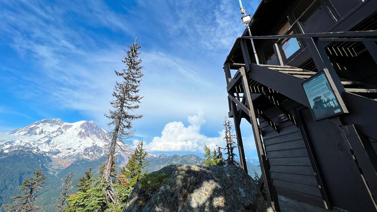 View of glaciated mountain from wooden fire lookout