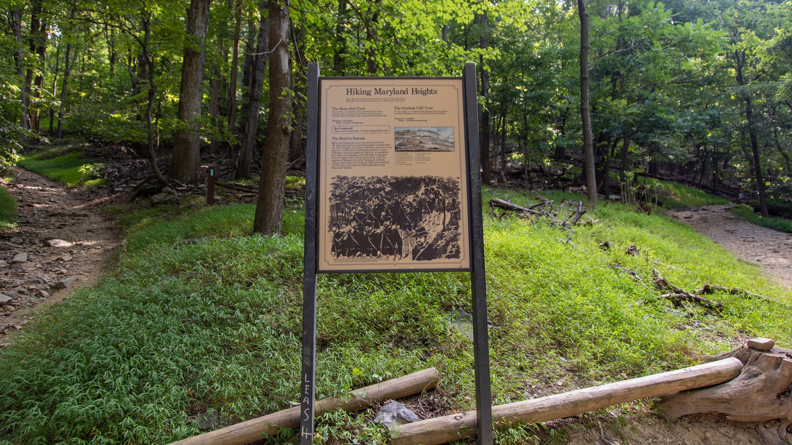 A black and white image shows retreating Federal troops descending the mountain. 