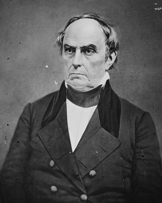 Black and white photo portrait of a man, Daniel Webster, wearing a dark coat over a white shirt.