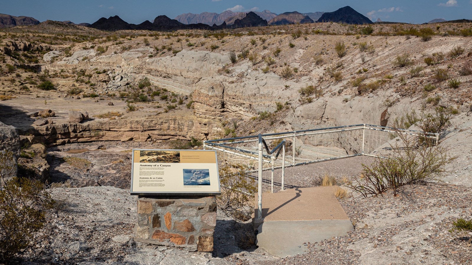 A wayside exhibit and viewing platform overlook the interior of Tuff Canyon.