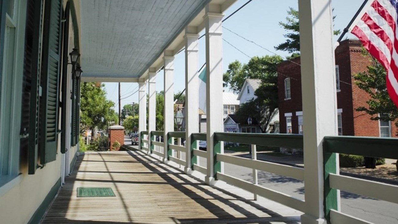 View of a street from the front porch of a home