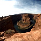 River in almost circular curve at bottom of sandstone canyon