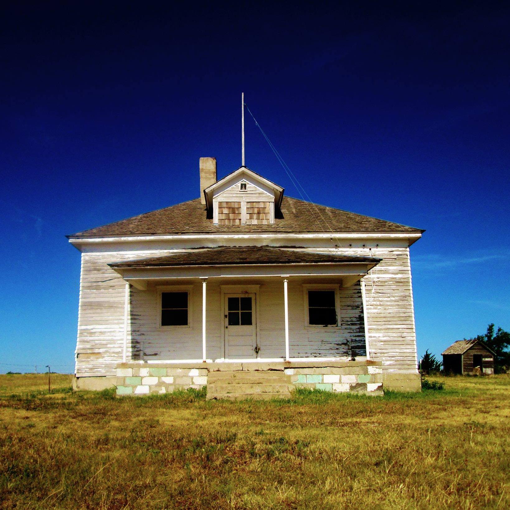White frame school house building