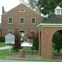 historic red brick buildings with historic marker