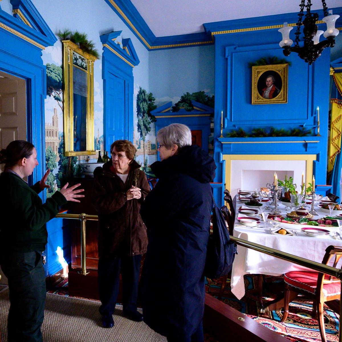 A park ranger gives a tour of the dining room inside the Hampton mansion.