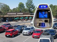 Superimposed ATM above cars in a parking lot with a brown general store building in the background