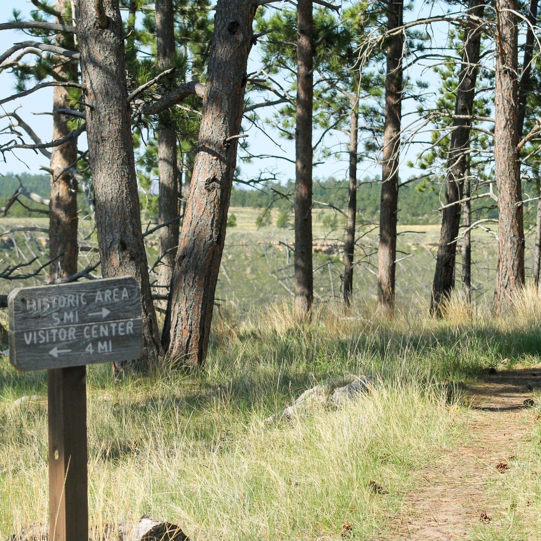 Wooden sign to Historic Area .5 miles and Visitor Center .4 miles