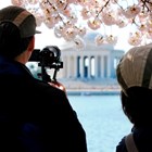 Visitors take photos of the Thomas Jefferson Memorial during the Cherry Blossom Festival.