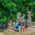 A living history interpreter shows visitors what it would have been like to run the gristmill.