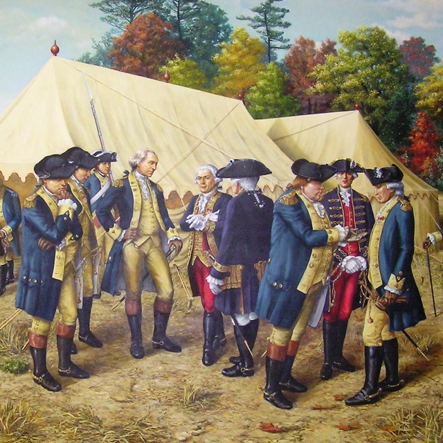 A painting of George Washington. He is standing in a group of men with blue coats, hand on hip. 