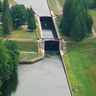 A view from above of a lock; large metal doors that block the water in a canal.