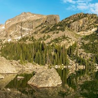 rocky mountains jutting over a lake