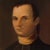 A portrait of a plain looking man with short hair, a clean shaven face, and a minister