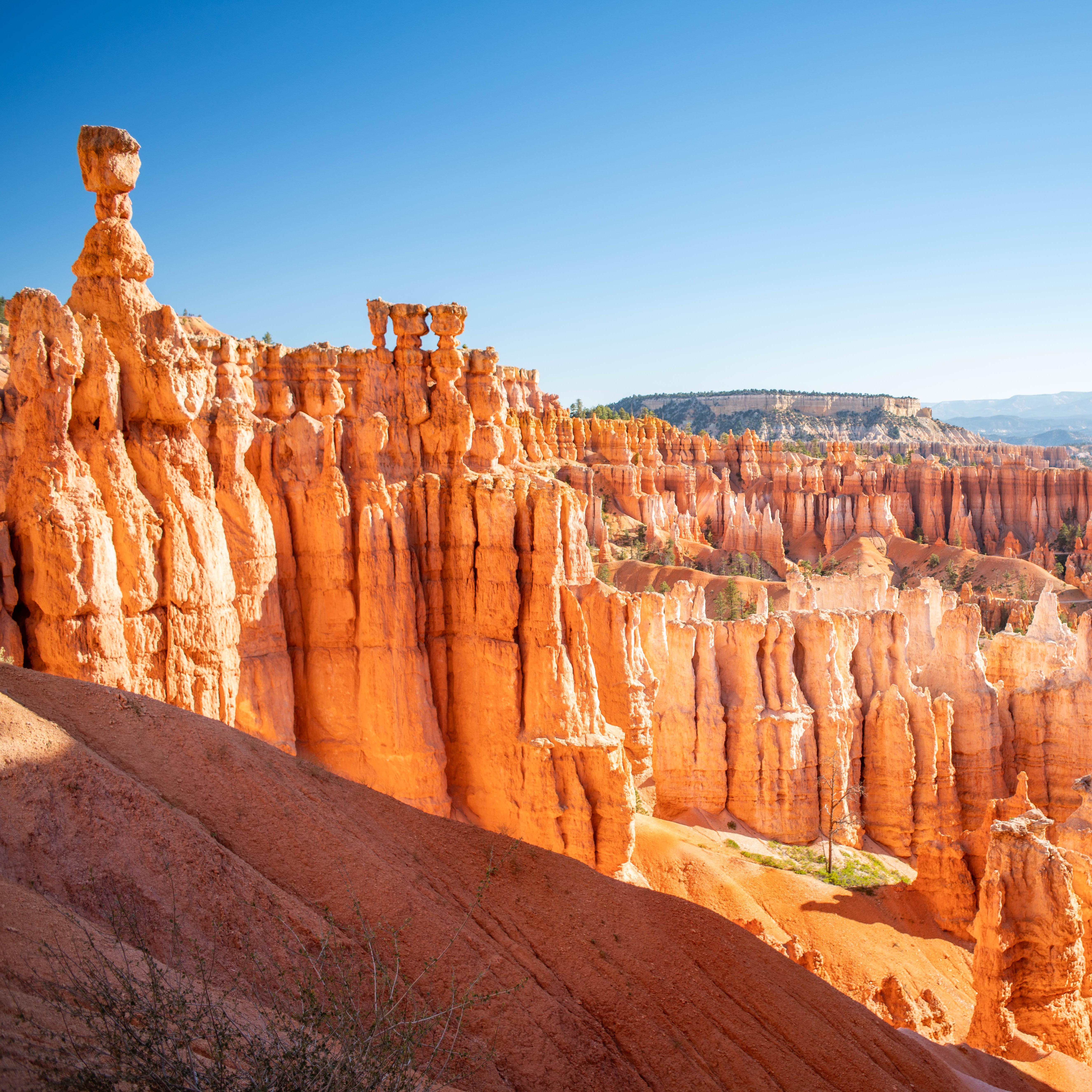 Red rock formations against a clear blue sky