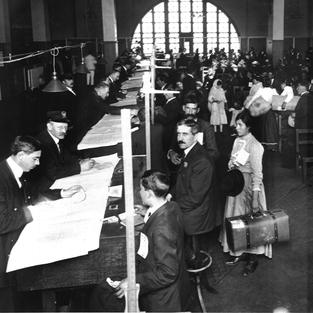 Immigrants awaiting processing at historic immigration center