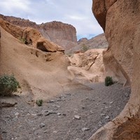 A trail winds through a canyon