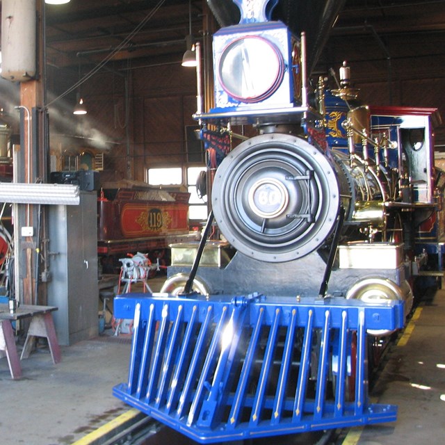 old train locomotives in a building