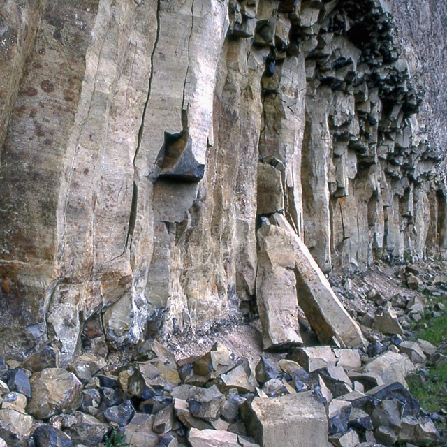 Blocks of stone falling off cliff face