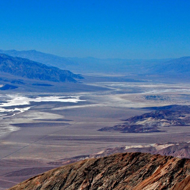 Dry desert valley surrounded by mountains