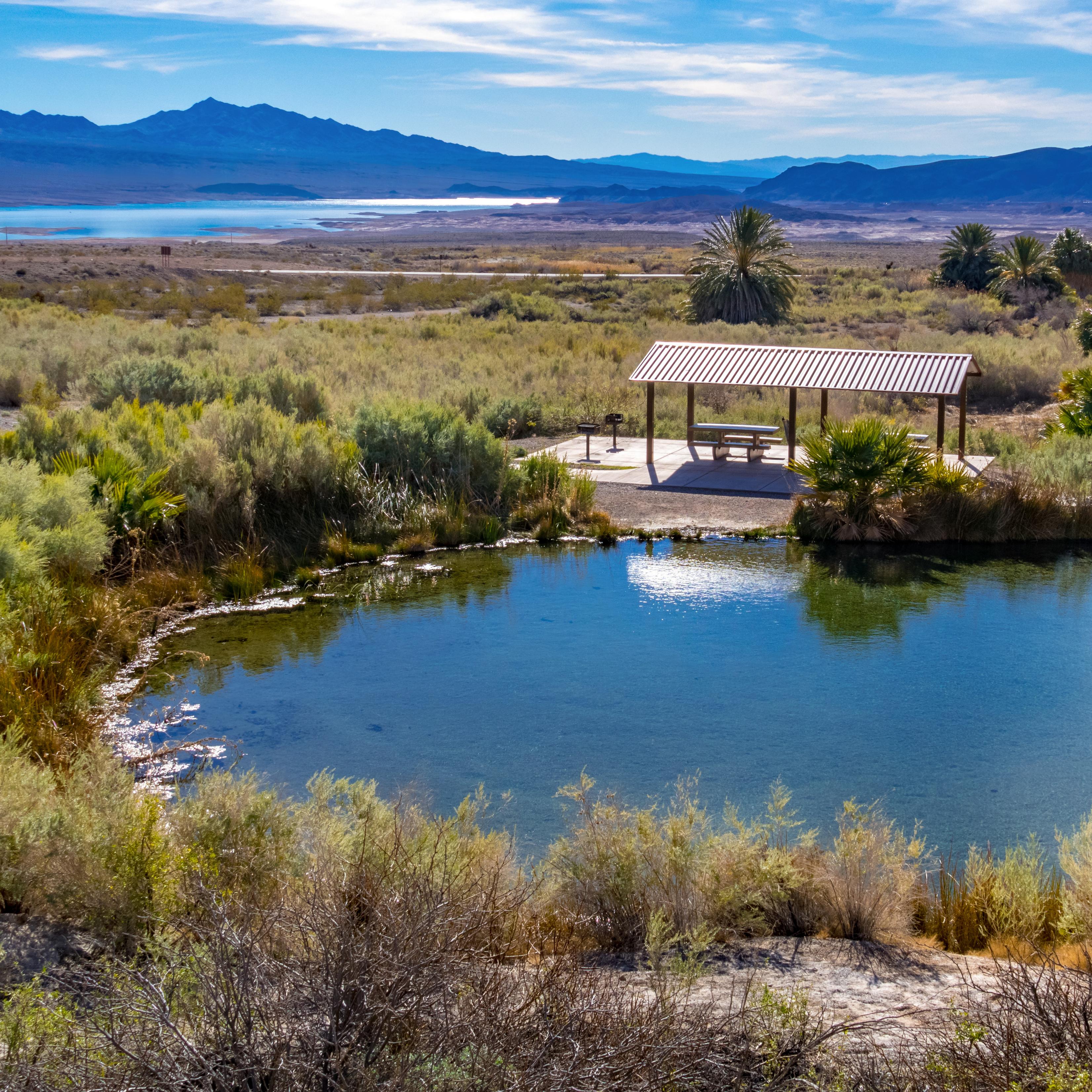 A picnic shelter next to a hot spring