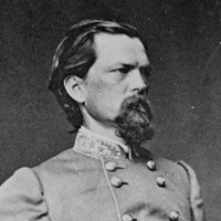 An 1860s standing portrait photo shows a thin bearded man in military officer