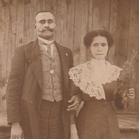 Man and woman pose for picture.