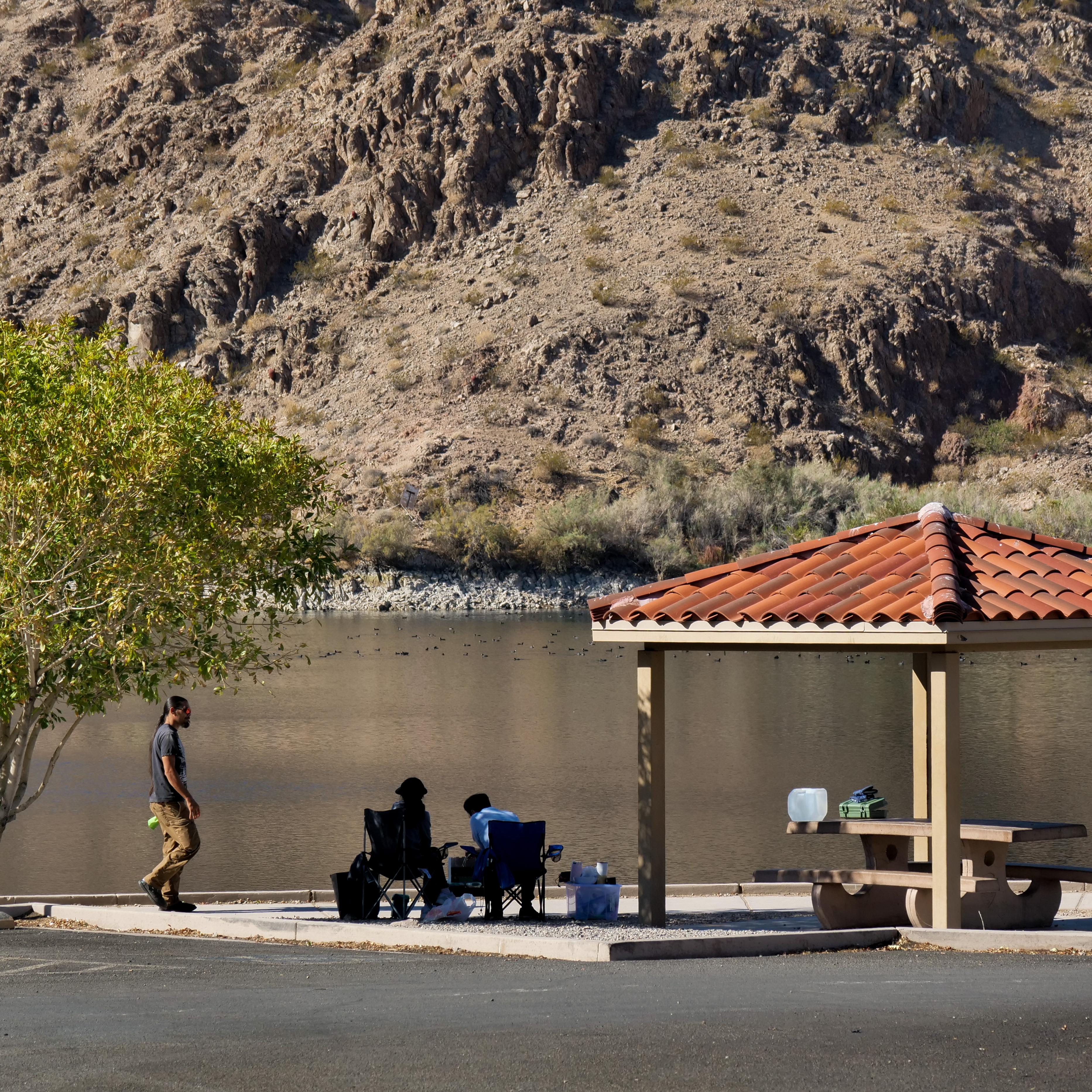 a picnic shelter next to water
