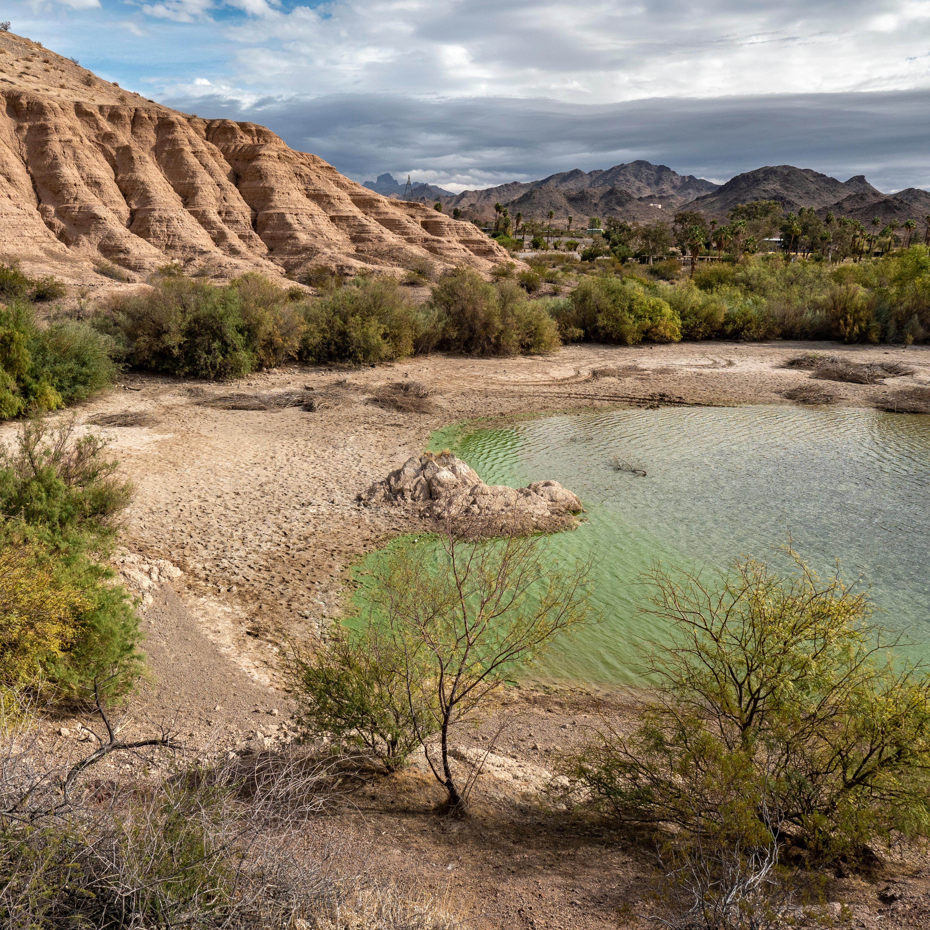 A cove next to a geologic formation.