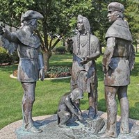 large statue with several men