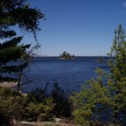 A view of Rainy Lake and islands framed by pine trees