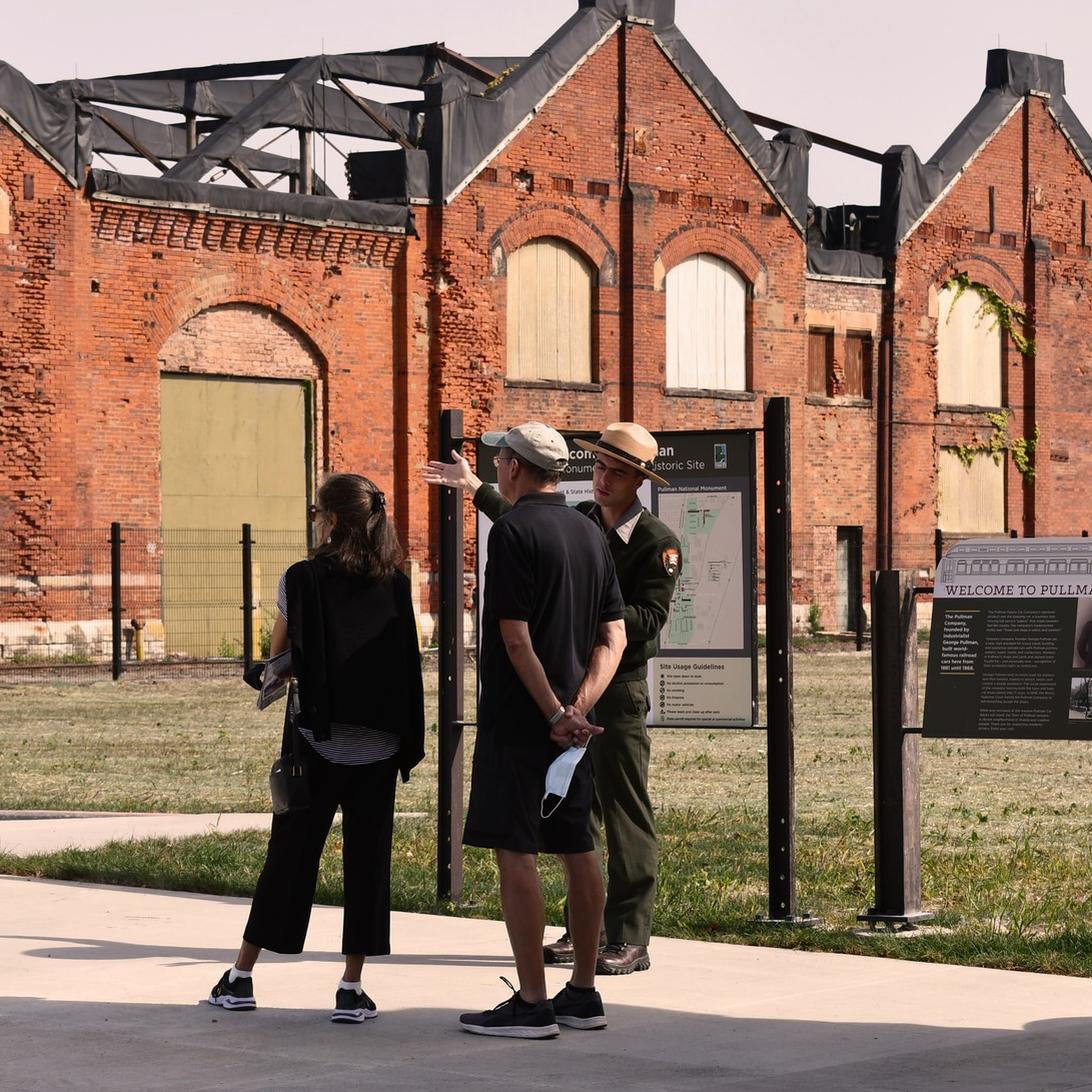 An NPS Ranger leads a tour of the Pullman Factory Grounds