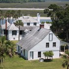 white kitchen house and plantation owners house and river