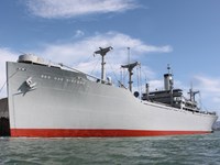 The historic SS Red Oak Victory Ship is tied to the dock.