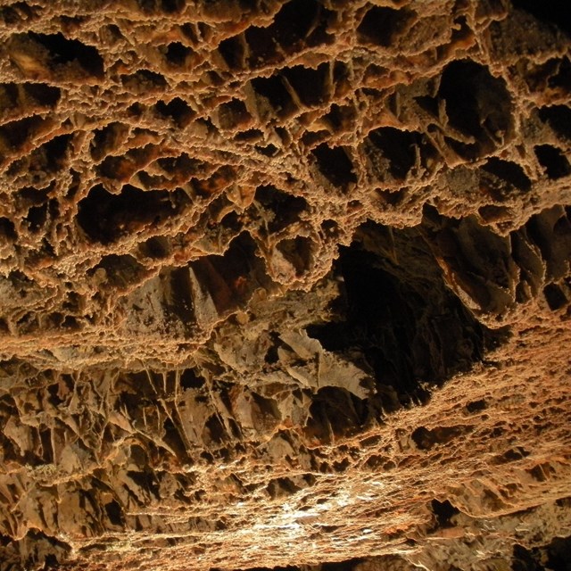 A cave formation with lattice-like structures