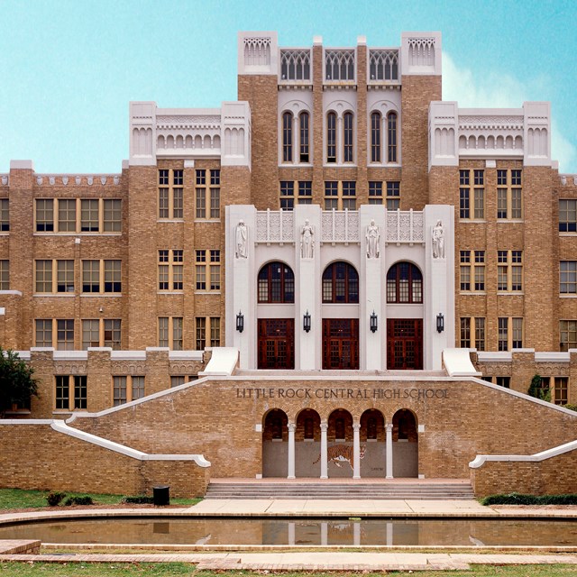 Exterior front of Central High School, a large, yellow-brick school