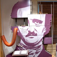 Color photo of exhibit component showing an enlarged photo of Edgar Allan Poe.