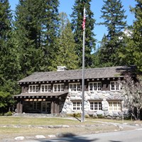 A two-story wood and rock building.